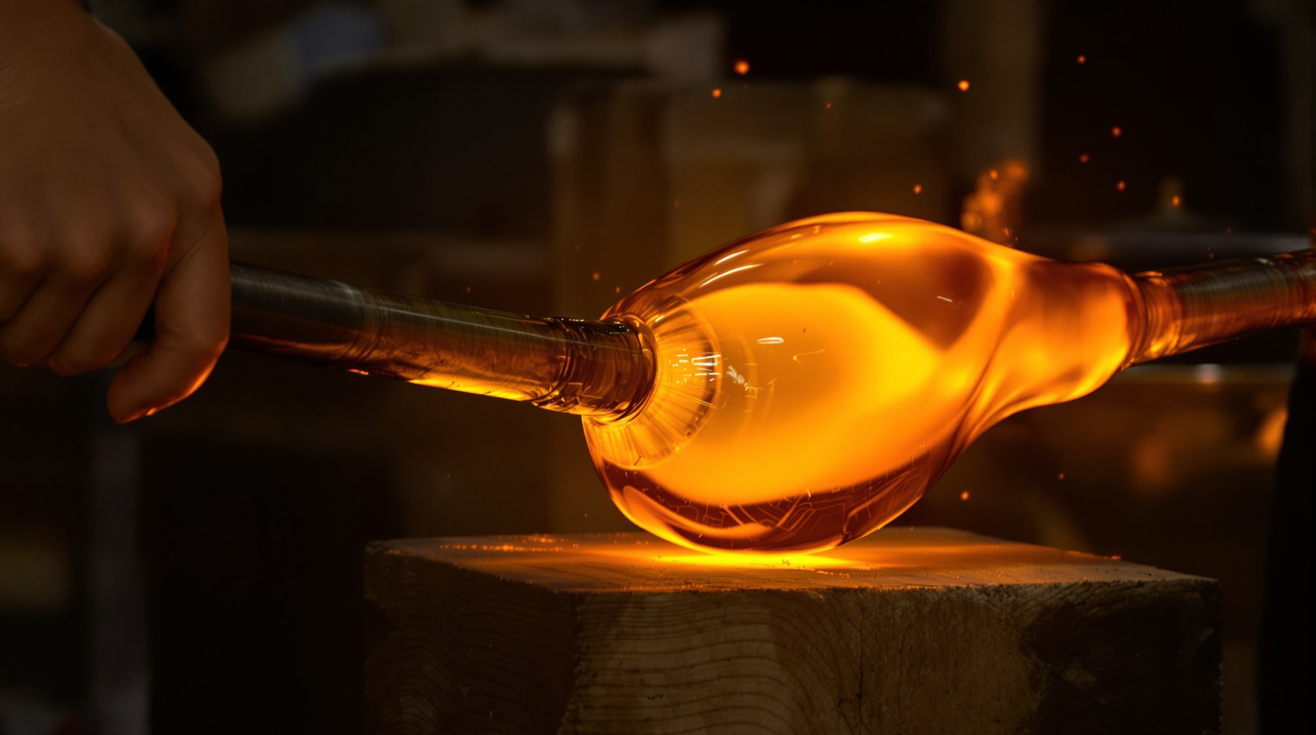 Translucent honey-coloured glass pieces catching the warm workshop light